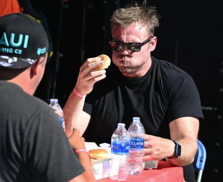 The Gazette | Competitors test their eating prowess during Labor Day Lift Off's doughnut-eating contest