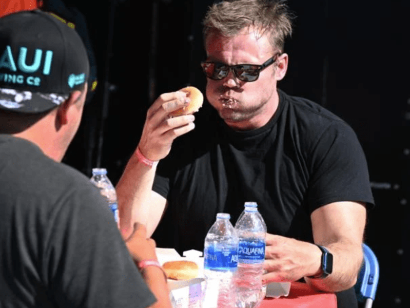 The Gazette | Competitors test their eating prowess during Labor Day Lift Off’s doughnut-eating&nbsp;contest